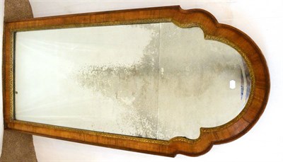 Lot 1194 - A Walnut and Parcel Gilt Pier Glass, in George II style, the bevelled glass mirror plate within...