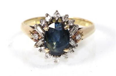 Lot 270 - A sapphire and diamond cluster ring, an oval cut sapphire within a border of baguette cut and...