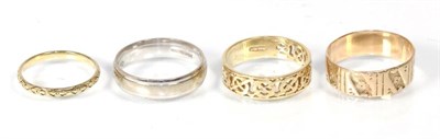 Lot 275 - A 9 carat gold Celtic motif band ring, finger size R1/2; an engraved band ring, finger size S;...