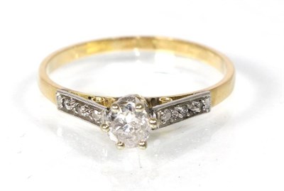 Lot 291 - A solitaire diamond ring, a round brilliant cut diamond in a claw setting, to diamond set...