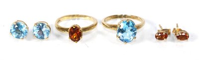 Lot 303 - A 9 carat gold oval cut blue topaz ring, finger size O1/2 and a pair of blue topaz stud earrings; a