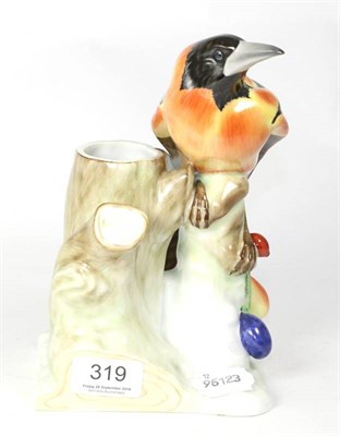 Lot 319 - A Herend porcelain model of a bird on naturalistic base