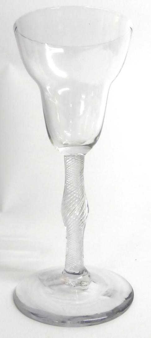 Lot 13 - A Wine Glass, circa 1750, the large pan topped bowl on a knopped air twist stem, 19cm high
