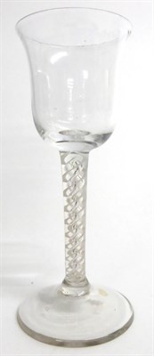 Lot 14 - A Wine Glass, circa 1750, the bell shaped bowl on a mixed opaque and air twist stem, 16cm high