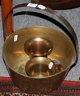Lot 1079 - A pair of bronze mortars and a brass jam pan