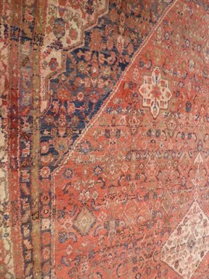 Lot 1095 - Hamadan carpet, Iranian Kurdistan, the crimson field centred by a stepped medallion framed by...