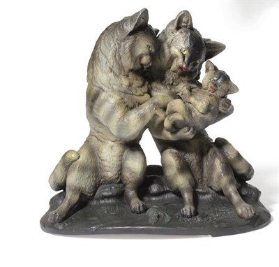 Lot 85 - An Austrian Painted Terracotta Cat Group, circa 1900, the mother and father seated upright...