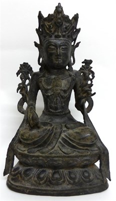 Lot 111 - A Chinese Bronze Figure of Buddha, Ming Dynasty, sitting cross-legged, his left hand raised, on...