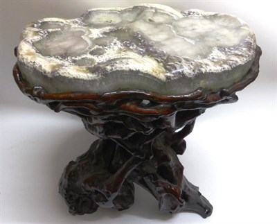 Lot 129 - A Chinese Polished Marble and Red Lacquer Water Table, the top with various pools, on a carved...