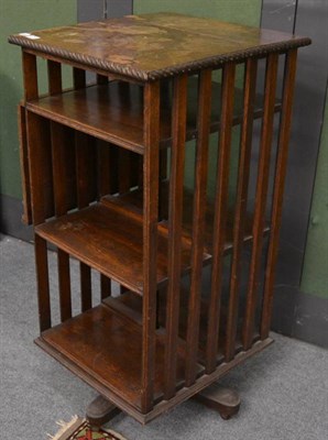 Lot 1250 - An oak revolving bookcase