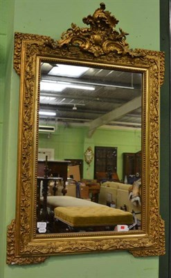 Lot 1252 - A gilt gesso wall mirror