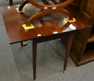 Lot 1274 - A late George III mahogany Pembroke table, square legs to castors