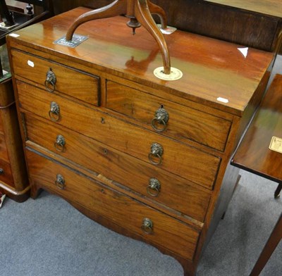 Lot 1275 - A George III mahogany chest of drawers, two short over three long drawers with lion mask handles