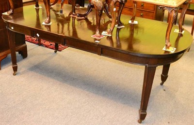 Lot 1287 - A mahogany wind out dining table with two leaves