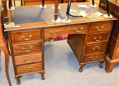 Lot 1291 - A reproduction blue leather inset kneehole desk