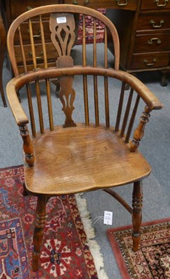 Lot 1292 - A 19th century yew and elm Windsor armchair