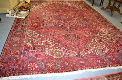 Lot 1316 - A Heriz carpet, Iranian Azerbyjan, the crimson field with central medallion framed by floral...