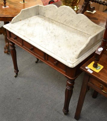 Lot 1344 - A Victorian marble topped mahogany washstand