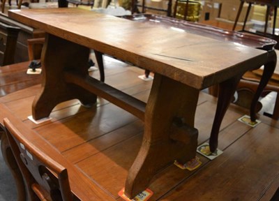 Lot 1351 - An English oak coffee table with shaped end supports