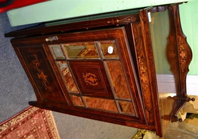 Lot 1357 - A carved oak glazed hanging cupboard of large proportions