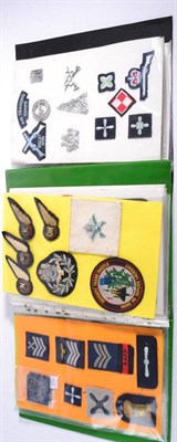 Lot 71 - Royal Air Force:- Two Folders of Badges and Insignia, including three RFC brass cap badges, six RAF