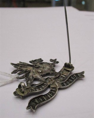 Lot 77 - A Rare First World War Silver Cap Badge to Eleventh Battalion Border Regiment, now brooched,...