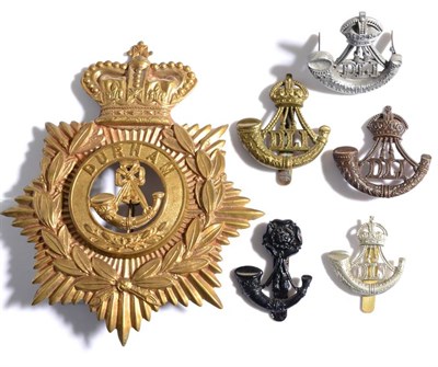 Lot 89 - The Durham Light Infantry:- an OR's brass helmet plate, an economy plastic cap badge, two other cap