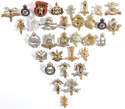 Lot 96 - A Collection of Twenty Nine Cavalry Field Service Cap Badges, in brass, white metal, bimetal...