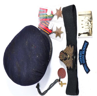 Lot 154 - Second World War Naval Interest:- a sailor's cap with HMS Ganges tally; a Naval Officer's...
