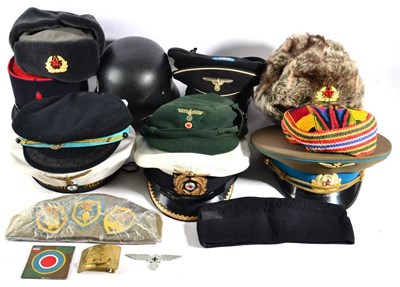Lot 177 - A Quantity of Military Hats, including a Russian Air Force officer's peaked cap, a copy of an...