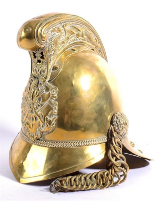 Lot 178 - A Victorian Merryweather Type Brass Fire Helmet, the raised comb embossed with a fire breathing...