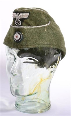 Lot 217 - A German Third Reich M38 Officer's Overseas Cap, in green/grey wool with silver metal thread...