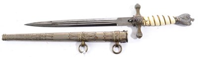 Lot 237 - A German Third Reich Kriegsmarine 1st. Model Dress Dagger, the 25 cm double edge twin fullered...