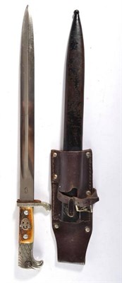 Lot 238 - A German Third Reich Police Dagger, one side of the single edge fullered steel blade stamped...