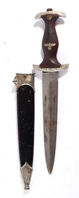 Lot 240 - A German Third Reich NSKK Dagger, the double edge blade bearing traces of etched inscription...