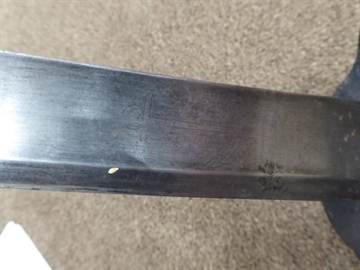 Lot 286 - A French Model 1833 Naval Cutlass, the 68 cm, broad, fullered, single edge blade engraved with...