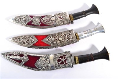 Lot 329 - Three Modern Presentation / Ornamental Kukris, two with horn grips, the other with plated grip, all