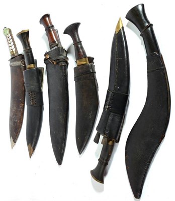 Lot 331 - An Indian Kukri, with 30cm round back blade, steel recurving crossguard, the greenstone and...