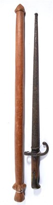 Lot 337 - A Vanuatu War Club, of orange coloured hard wood, the flat topped tapering cylindrical head...