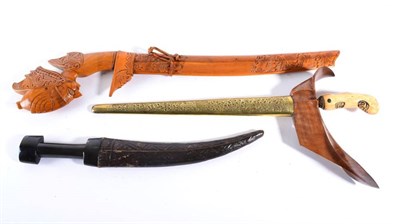 Lot 338 - A Javanese Kris, with 35cm eleven lok pamor blade, gilt metal mendak set with glass stones,...