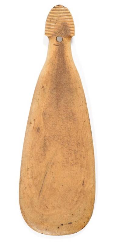 Lot 356 - A Maori Whalebone Patu Paraoa, of flattened paddle form, the ribbed handle pierced for a thong,...
