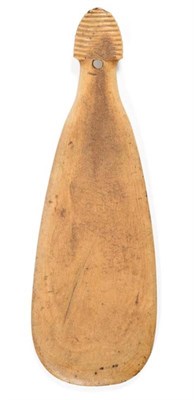 Lot 356 - A Maori Whalebone Patu Paraoa, of flattened paddle form, the ribbed handle pierced for a thong,...