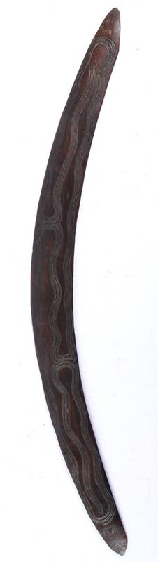 Lot 357 - A 19th Century Aboriginal War Boomerang, incised to one side with a sinuous snake-like design...