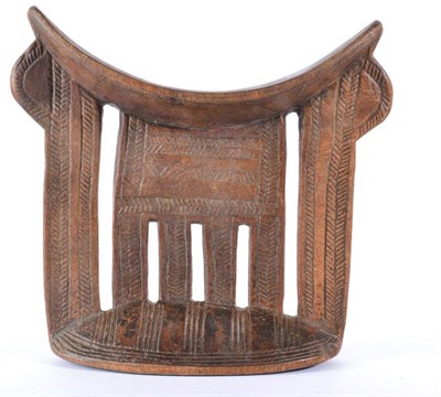 Lot 374 - A Shona Headrest, Zimbabwe, with curved top with a central comb shape support flanked by flat...