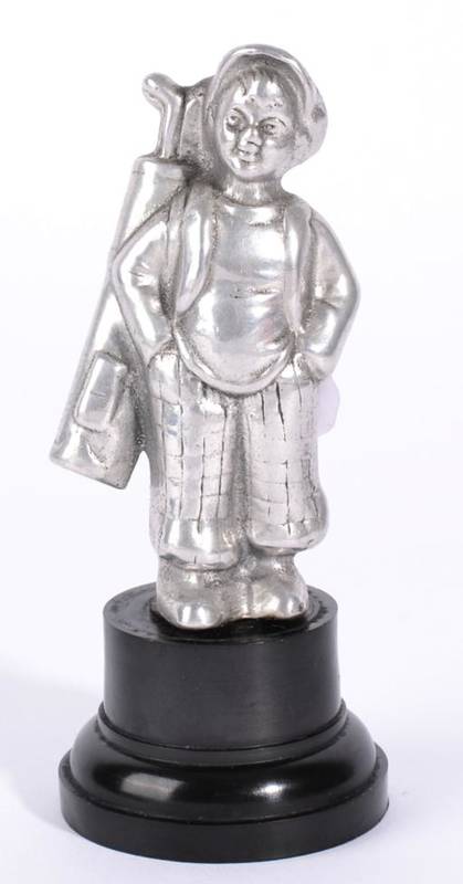 Lot 1005 - A Vintage Polished Aluminium Sporting Accessory Mascot, modelled as a caddy boy, circa 1920/30s, on