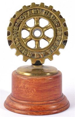 Lot 1028 - A Brass Car Mascot, Saltburn-by-the-Sea Rotary Club, with circular base and mounted on a later...