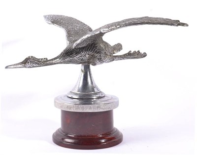 Lot 1029 - A Chrome on Brass Car Mascot, in the form of a heron with outswept wings, mounted on a chromed...