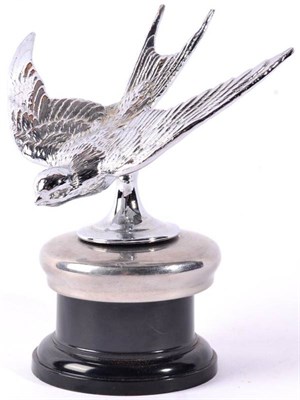 Lot 1030 - A Chrome Car Mascot, in the form of a Swift with outstretched wings, mounted on a chrome cap...