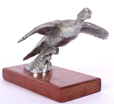 Lot 1046 - A Nickel on Brass Car Mascot, in the form of pheasant with wings outstretched, on a stained...