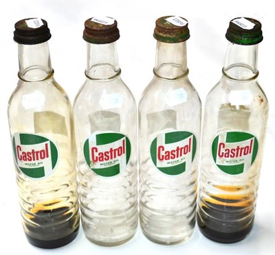 Lot 1065 - Four Vintage Castrol Motoroil Oil Bottles, with original lids, the verso printed Contents 1...